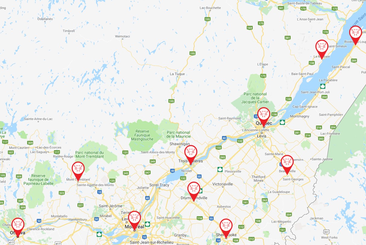 Carte du Québec montrant les points de service et zones de livraison du Traiteur Braisé avec ses épingles rouges logo taureau